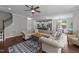 Open-concept living room leading into the kitchen and dining area, with hardwood floors at 3122 Jones Lake Rd, Fuquay Varina, NC 27526