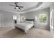 Spacious main bedroom with large windows and ceiling fan, ensuring a relaxing atmosphere at 3122 Jones Lake Rd, Fuquay Varina, NC 27526