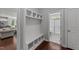 Practical mudroom with built-in bench and storage, conveniently located near a bathroom at 3122 Jones Lake Rd, Fuquay Varina, NC 27526