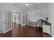 Home office featuring a tray ceiling, French doors, and built-in shelving for organization at 3122 Jones Lake Rd, Fuquay Varina, NC 27526