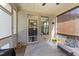 Cozy screened porch with stylish rug, comfortable seating, and lots of natural light at 3122 Jones Lake Rd, Fuquay Varina, NC 27526