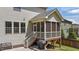 Back of house featuring a screened in porch, grill, and steps down to the backyard at 3122 Jones Lake Rd, Fuquay Varina, NC 27526