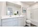 Bathroom features a dual sink vanity, a well lit mirror, and a shower-tub combination at 314 N Coral Bells Way, Four Oaks, NC 27524
