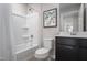 Clean bathroom featuring a shower-tub combo, toilet, and vanity with storage at 314 N Coral Bells Way, Four Oaks, NC 27524