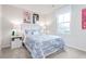 Bright bedroom decorated with fun llama-themed art and soft blue bedding at 314 N Coral Bells Way, Four Oaks, NC 27524