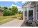 Enjoy outdoor living on this patio with a view of the lush backyard and attractive landscaping at 316 Ibis Ln, Durham, NC 27703