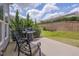 Relax on the patio with a grill, a serene backyard, and a retaining wall for added privacy at 316 Ibis Ln, Durham, NC 27703