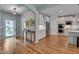 Inviting entryway and open-concept kitchen featuring hardwood floors and stainless steel appliances at 316 Ibis Ln, Durham, NC 27703