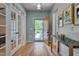 Welcoming foyer with hardwood floors, natural light, and a view leading to the main living spaces at 316 Ibis Ln, Durham, NC 27703