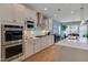 Well-equipped kitchen with stainless steel appliances, white cabinets, and center island with seating at 316 Ibis Ln, Durham, NC 27703