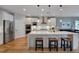 Modern kitchen with a large center island, stainless steel appliances, and stylish pendant lighting at 316 Ibis Ln, Durham, NC 27703