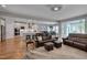 Spacious living room with an open layout to the kitchen, featuring hardwood floors and plenty of seating at 316 Ibis Ln, Durham, NC 27703