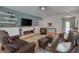 Inviting living room with custom built-ins, a modern fireplace, and an open layout with hardwood floors at 316 Ibis Ln, Durham, NC 27703