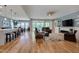 Open-concept living area with hardwood floors, fireplace, and seamless flow to dining and kitchen at 316 Ibis Ln, Durham, NC 27703