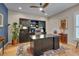 Home office with hardwood floors, dark wood built-ins, and a large desk for productivity at 316 Ibis Ln, Durham, NC 27703