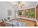 Bright sunroom featuring a ceiling fan, comfortable seating, and scenic views at 3405 Bonaparte Way, Durham, NC 27707
