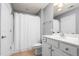 Well-lit bathroom featuring a shower and tub combination, white vanity, and tile flooring at 342 Faith Dr, Gibsonville, NC 27249