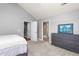Spacious bedroom boasts neutral decor, access to ensuite bathroom, and ample closet space at 342 Faith Dr, Gibsonville, NC 27249