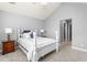 Comfortable bedroom featuring a white four poster bed and neutral color scheme at 342 Faith Dr, Gibsonville, NC 27249