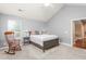 Light-filled bedroom showcasing vaulted ceilings, neutral walls, and plush carpet at 342 Faith Dr, Gibsonville, NC 27249