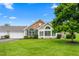 Charming home with stone accents, lush lawn, and mature tree on a beautiful, sunny day at 342 Faith Dr, Gibsonville, NC 27249