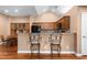 Well-equipped kitchen with granite countertops and stainless steel appliances, open to the dining area at 342 Faith Dr, Gibsonville, NC 27249