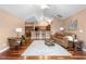 Bright living room with hardwood floors, vaulted ceiling, and open layout to the kitchen at 342 Faith Dr, Gibsonville, NC 27249