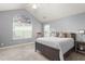 Bright main bedroom with vaulted ceiling, arched window, and comfortable furnishings at 342 Faith Dr, Gibsonville, NC 27249