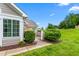 Charming patio area perfect for relaxing, with lush greenery and a cozy seating arrangement at 342 Faith Dr, Gibsonville, NC 27249