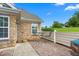 Inviting patio features a stone wall, seating, and stamped concrete, ideal for outdoor enjoyment at 342 Faith Dr, Gibsonville, NC 27249