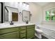 Bathroom with dual sink vanity, framed mirrors, and soaking tub at 361 Anterbury Dr # B, Apex, NC 27502