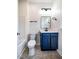 Bathroom features a toilet, vanity with navy cabinets, and a bathtub at 361 Anterbury Dr # B, Apex, NC 27502