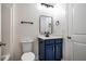 Bathroom with blue vanity, modern sink, and framed mirror at 361 Anterbury Dr # B, Apex, NC 27502
