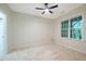 Neutral bedroom features a ceiling fan, and a window overlooking nature at 361 Anterbury Dr # B, Apex, NC 27502