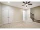 Neutral bedroom features a ceiling fan, and a closet with double doors at 361 Anterbury Dr # B, Apex, NC 27502