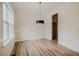 Dining room with hardwood floors and a modern chandelier at 361 Anterbury Dr # B, Apex, NC 27502