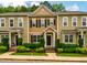 Charming townhome with manicured landscaping and inviting front entrance at 361 Anterbury Dr # B, Apex, NC 27502
