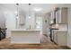 Well-lit kitchen with stainless steel appliances, breakfast bar, and modern gray cabinets at 361 Anterbury Dr # B, Apex, NC 27502