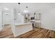 Modern kitchen with breakfast bar, stainless steel appliances, and stylish pendant lights at 361 Anterbury Dr # B, Apex, NC 27502