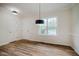 A room with a front door, window, light fixture and luxury vinyl flooring at 361 Anterbury Dr # B, Apex, NC 27502