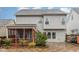 The back exterior features a screened porch and a stone paver patio in a well-maintained backyard at 3904 Freemark Ln, Fuquay Varina, NC 27526