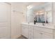 Modern bathroom features a double sink vanity with granite countertop and large mirrors at 3904 Freemark Ln, Fuquay Varina, NC 27526