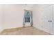 Bright, carpeted bedroom featuring a window and a closet with paneled doors at 3904 Freemark Ln, Fuquay Varina, NC 27526