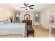 Spacious bedroom with tray ceiling, a ceiling fan and natural light from large windows at 3904 Freemark Ln, Fuquay Varina, NC 27526