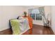 Bright bedroom with hardwood floors, neutral walls, and natural light from the window at 3904 Freemark Ln, Fuquay Varina, NC 27526