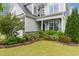 Attractive home with a well-maintained lawn, mature landscaping, and a charming front entrance at 3904 Freemark Ln, Fuquay Varina, NC 27526
