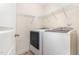 Well-organized laundry room with a modern washer and dryer and wire shelving at 3904 Freemark Ln, Fuquay Varina, NC 27526