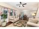 Comfortable living room showcasing hardwood floors, ample seating, and an open layout to the dining area at 3904 Freemark Ln, Fuquay Varina, NC 27526