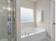 Bathtub shower combination in a well-lit bathroom at 3909 Mendenhall Dr, Zebulon, NC 27597