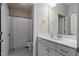 Neutral-toned bathroom with a vanity, toilet, and shower/tub combination enclosed by a white curtain at 3909 Mendenhall Dr, Zebulon, NC 27597